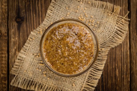 Sweet Mustard on a vintage background as detailed close-up shot (selective focus)