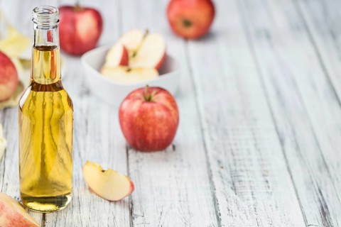 Apple Cider on a vintage background as detailed close-up shot (selective focus)