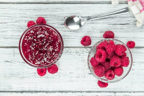 Some homemade Raspberry Jam as detailed close-up shot, selective focus