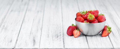Portion of fresh Strawberries close-up shot, selective focus