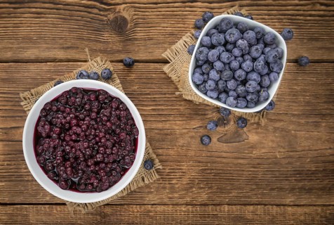 Preserved Blueberries on a vintage background as detailed close-up shot, selective focus
