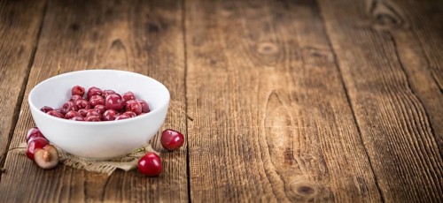 Preserved Cherries on a vintage background as detailed close-up shot, selective focus