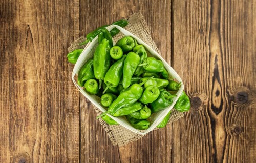 Raw Pimientos on a vintage background as detailed close-up shot, selective focus
