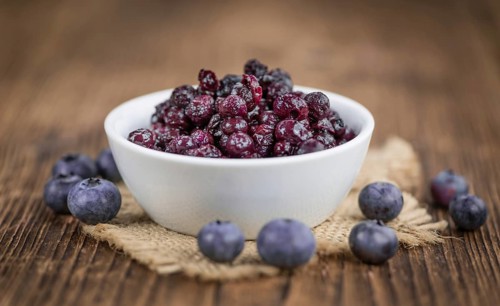 Fresh made Blueberries (preserved) on a vintage background as detailed close-up shot