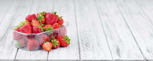 Strawberries on a vintage background as detailed close-up shot, selective focus