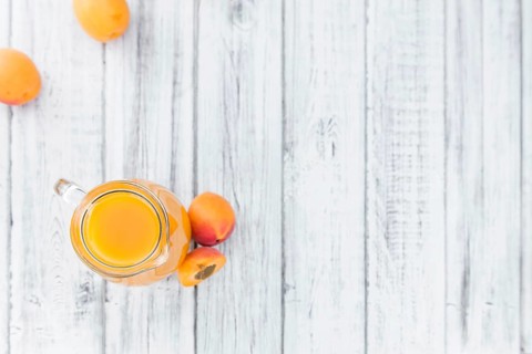Some homemade Apricot Juice (selective focus) as detailed close-up shot