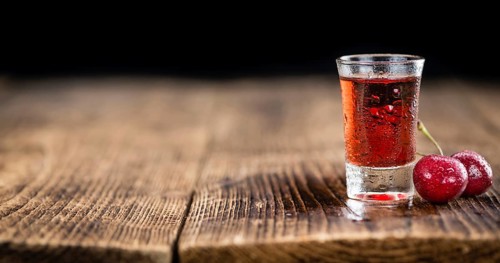 Some homemade Cherry Liqueur as detailed close-up shot, selective focus