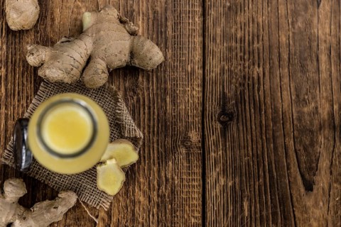 Portion of healthy Ginger Drink (selective focus, close-up shot)