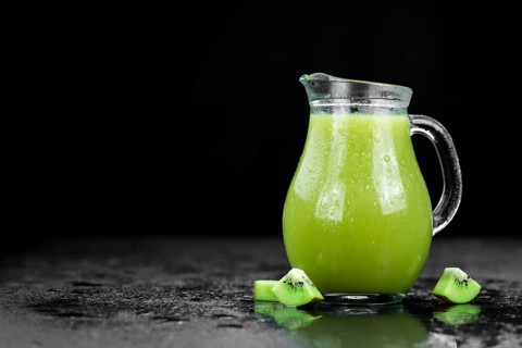 Fresh made Kiwi Smoothie (selective focus) on a vintage looking background
