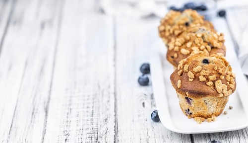 Some fresh Blueberry Muffins (selective focus, close-up shot)