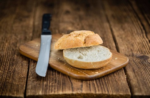 Rolls (German style) on rustic wooden background as close-up shot