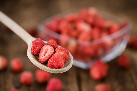 Dried Strawberries on a vintage background as detailed close-up shot, selective focus