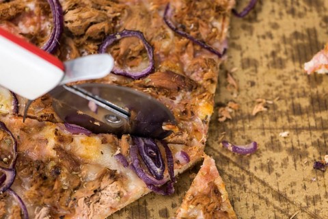 Portion of sliced Pizza (detailed close-up shot, selective focus)