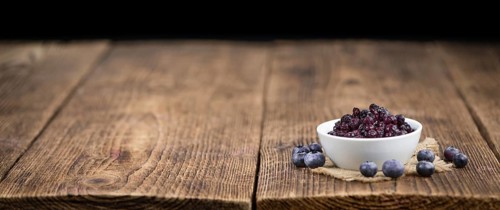 Fresh made Blueberries (preserved) on a vintage background as detailed close-up shot