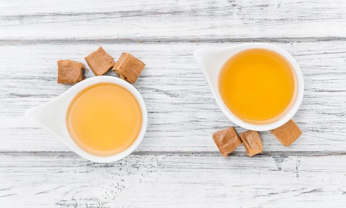 Portion of fresh Caramel Sirup (close-up shot, selective focus)