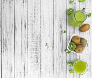 Kiwi Smoothie (selective focus) on an old and vintage background (homemade)