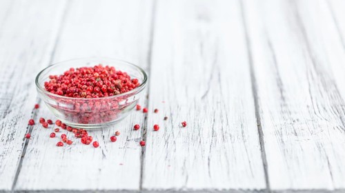 Portion of fresh Pink Peppercorns close-up shot, selective focus