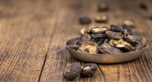 Some homemade Shiitake mushrooms (dried) as detailed close-up shot, selective focus