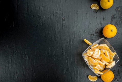 Portion of tangerines (close-up shot) on a vintage background (selective focus)