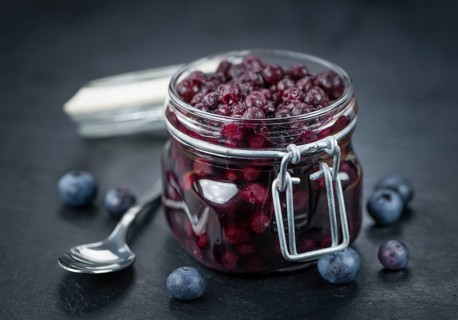 Preserved Blueberries on a vintage background as detailed close-up shot, selective focus