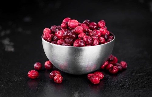 Portion of healthy Dried Cranberries (selective focus, close-up shot)