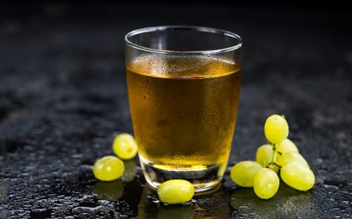 Some healthy Grape Juice (selective focus, close-up shot)