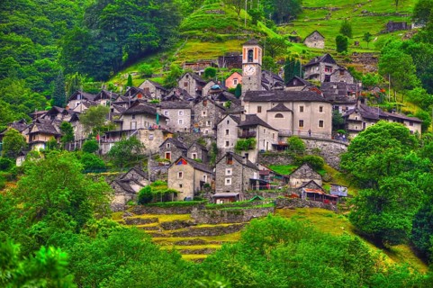 Beautiful Old Rustic Alpine Village on the Mountain Side with Green Trees in Corippo, Ticino,