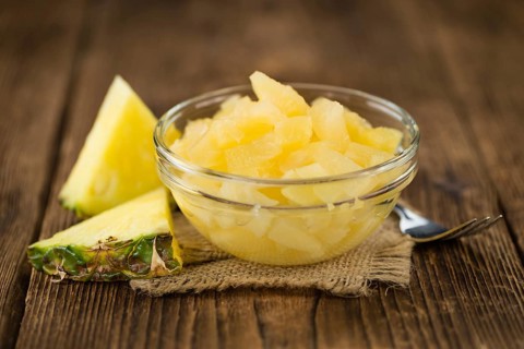 Portion of fresh Preserved Pineapple pieces close-up shot, selective focus