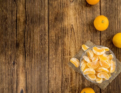 Portion of tangerines (close-up shot) on a vintage background (selective focus)