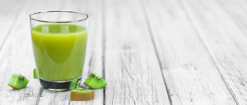 Fresh made Kiwi Smoothie (selective focus) on a vintage looking background