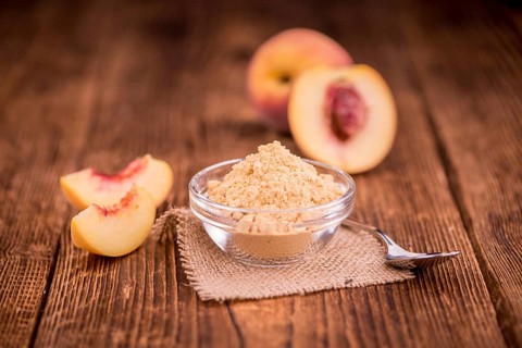 Portion of fresh Ground Peaches close-up shot, selective focus