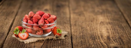 Dried Strawberries on a vintage background as detailed close-up shot, selective focus