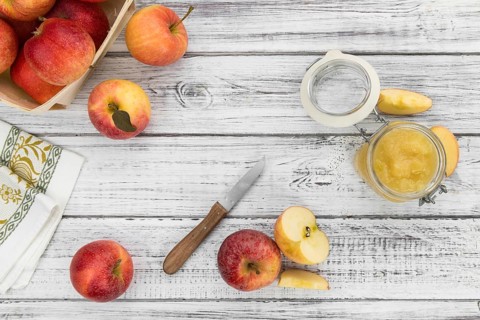 Portion of homemade Applesauce (selective focus, close-up shot) on vintage background