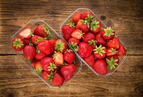 Strawberries on a vintage background as detailed close-up shot, selective focus