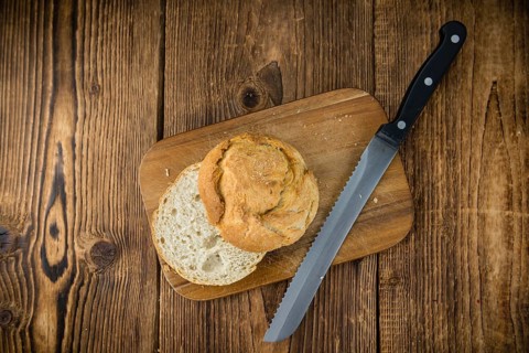 Fresh made German Buns on an old and rustic wooden table, selective focus, close-up shot