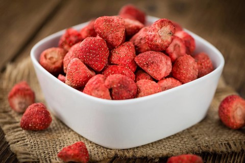 Dried Strawberries on a vintage background as detailed close-up shot, selective focus