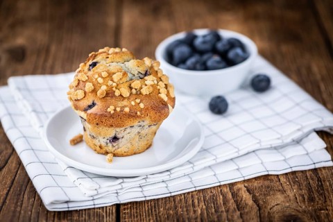 Fresh Blueberry Muffins as detailed close-up shot (selective focus)