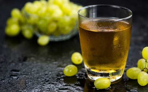 Some healthy Grape Juice (selective focus, close-up shot)