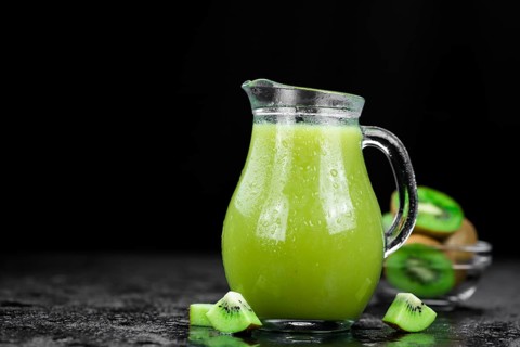 Fresh made Kiwi Smoothie (selective focus) on a vintage looking background