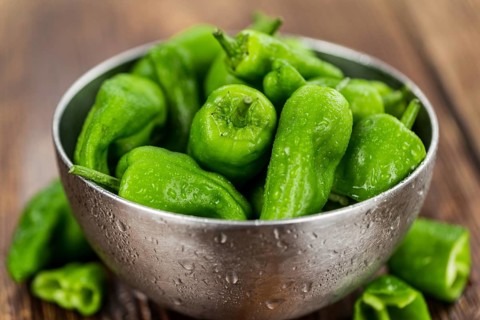 Raw Pimientos on a vintage background as detailed close-up shot, selective focus