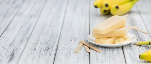 Banana Popsicles on a vintage background (close-up shot, selective focus)