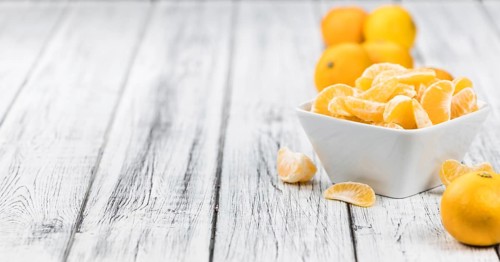 Portion of tangerines (close-up shot) on a vintage background (selective focus)