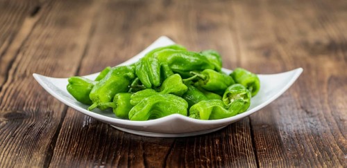 Portion of fresh Raw Pimientos close-up shot, selective focus