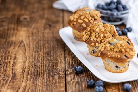 Some fresh Blueberry Muffins (selective focus, close-up shot)
