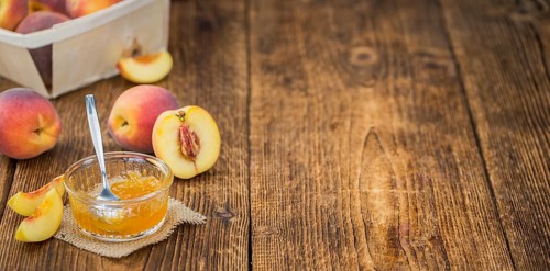 Peach Jam on a vintage background as detailed close-up shot, selective focus