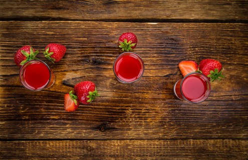 Some homemade Strawberry liqueur as detailed close-up shot, selective focus