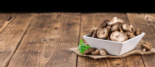 Portion of fresh Shiitake mushrooms close-up shot, selective focus