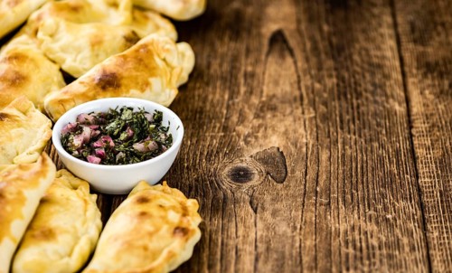Portion of fresh homemade Empanadas as detailed close-up shot, selective focus