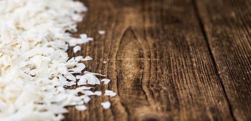 Fresh Coconut Flakes as detailed close-up shot (selective focus)