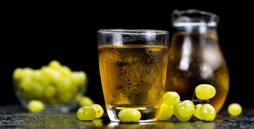 Some healthy Grape Juice (selective focus, close-up shot)